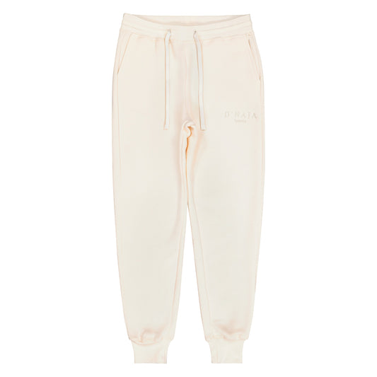 Women's fleece sweatpants displayed on a clean, white background. The sweatpants are cream and have a relaxed fit, elastic waistband, and drawstring. Crafted from soft fleece fabric, they offer warmth and comfort. Two side pockets are visible, adding functionality. Perfect for leisure activities, workouts, or casual wear.