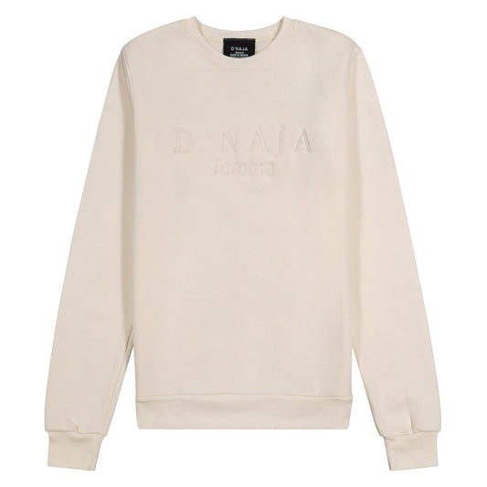 Unisex cream fleece crewneck sweatshirt with the D'naja logo prominently displayed, showcasing contemporary style and brand recognition